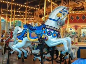 White horse with blue armor on Cinderalla's Carousel