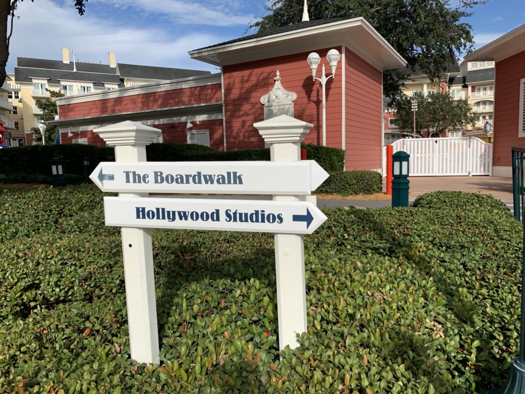 Directional sign pointing the way to Boardwalk Inn, a Disney deluxe resort, and Disney Studios