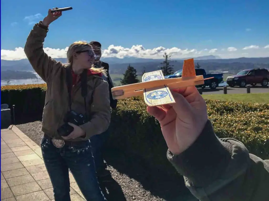 Balsa wood glider being held near Astoria Column Oregon