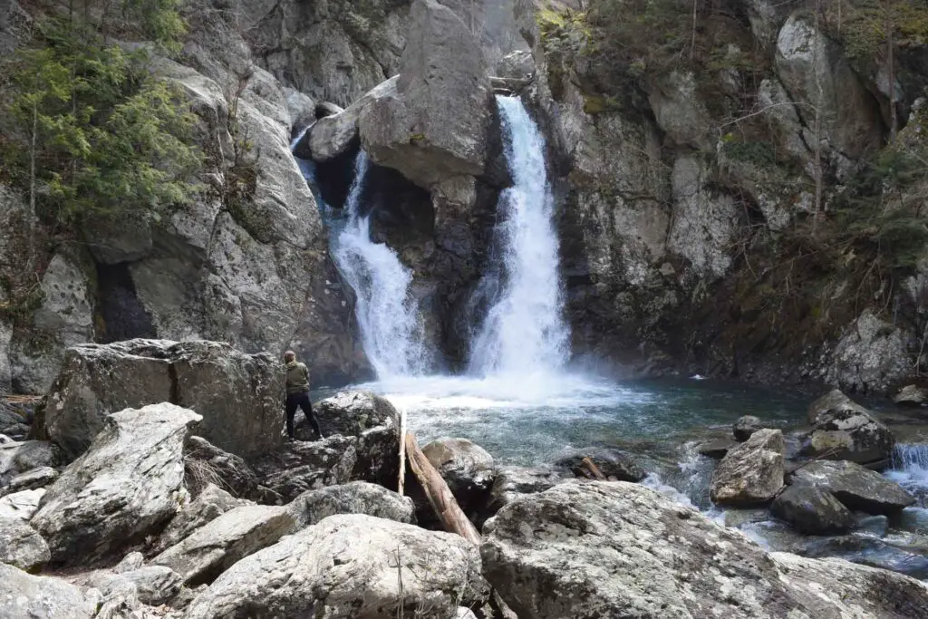 The two sides of Bash Bish Falls roaring with spring flow.