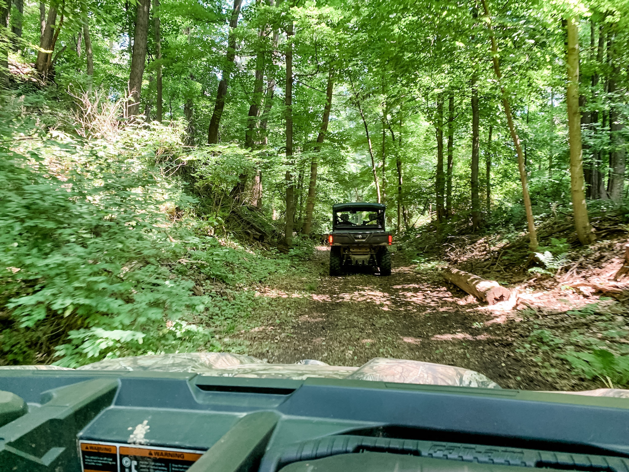 ATV rental Connecticut traveling through the state's woodlands.