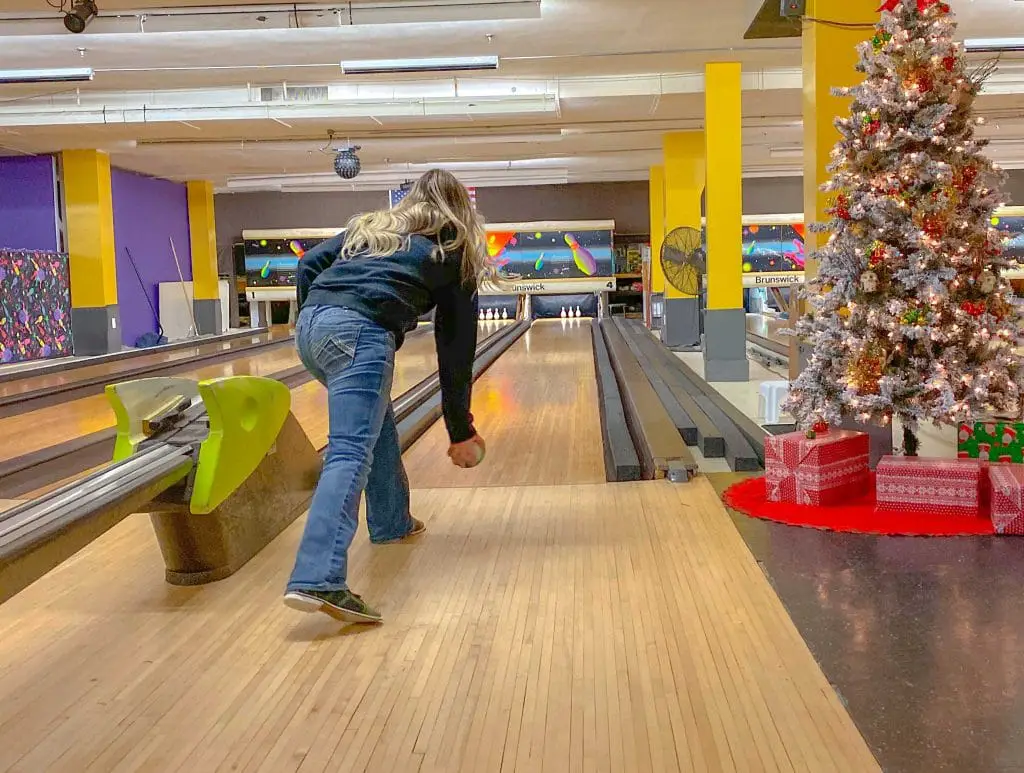 Young woman takes a shot at Duckpin bowling, a disappearing thing to do in Connecticut in the winter.