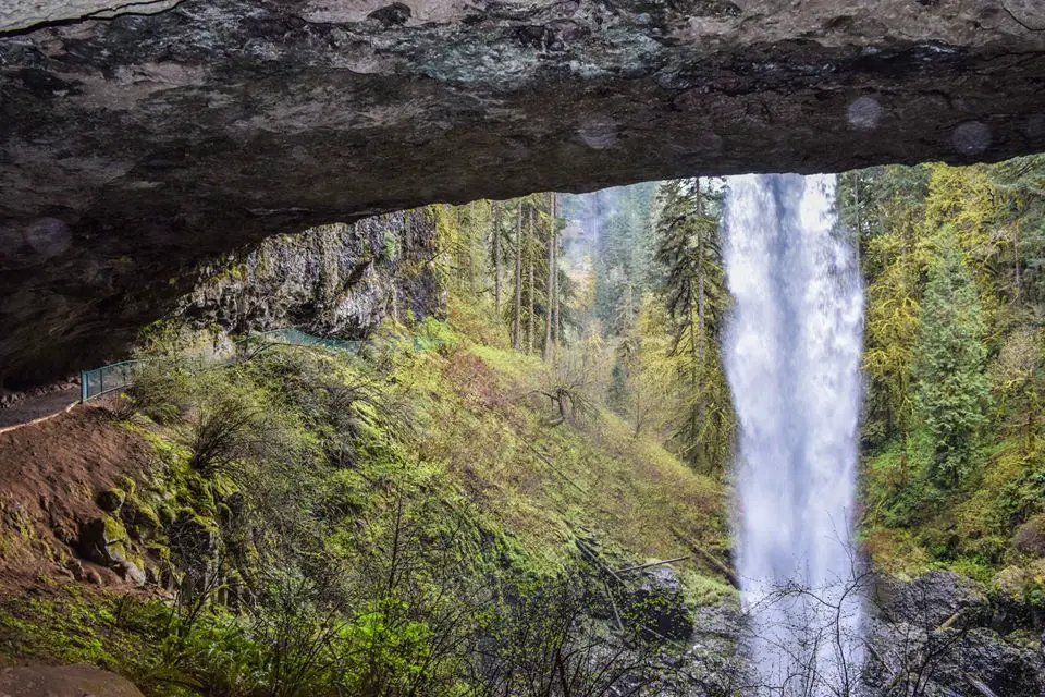 View of waterfall from behind at Silver Falls State Park, one of the most scenic places in Oregon