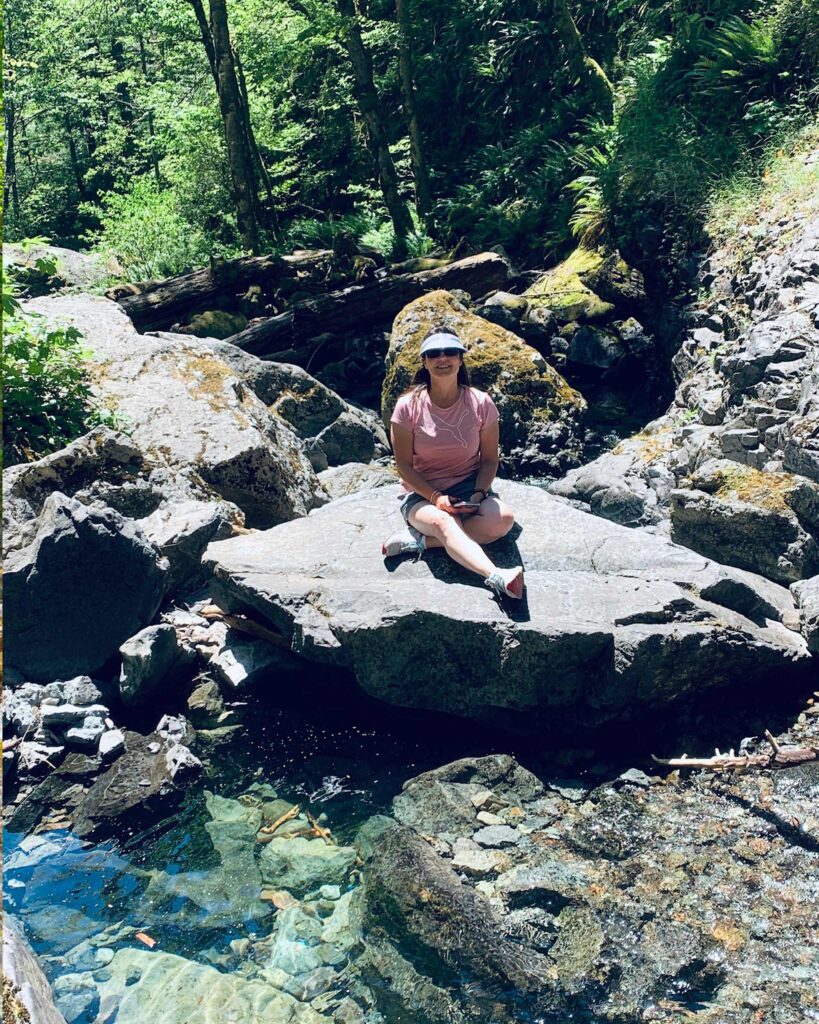 woman on rock henline falls oregon