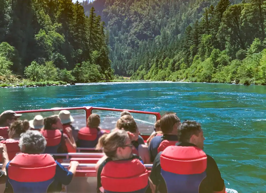 People enjoying the Oregon outdoors on a Rogue River jet boat tour