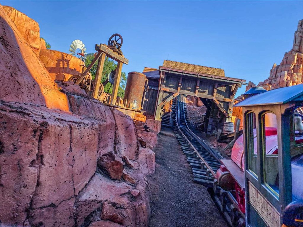 Train heading up the track on Thunder Mountain, one of the rides shared between Disney World vs Disneyland rides