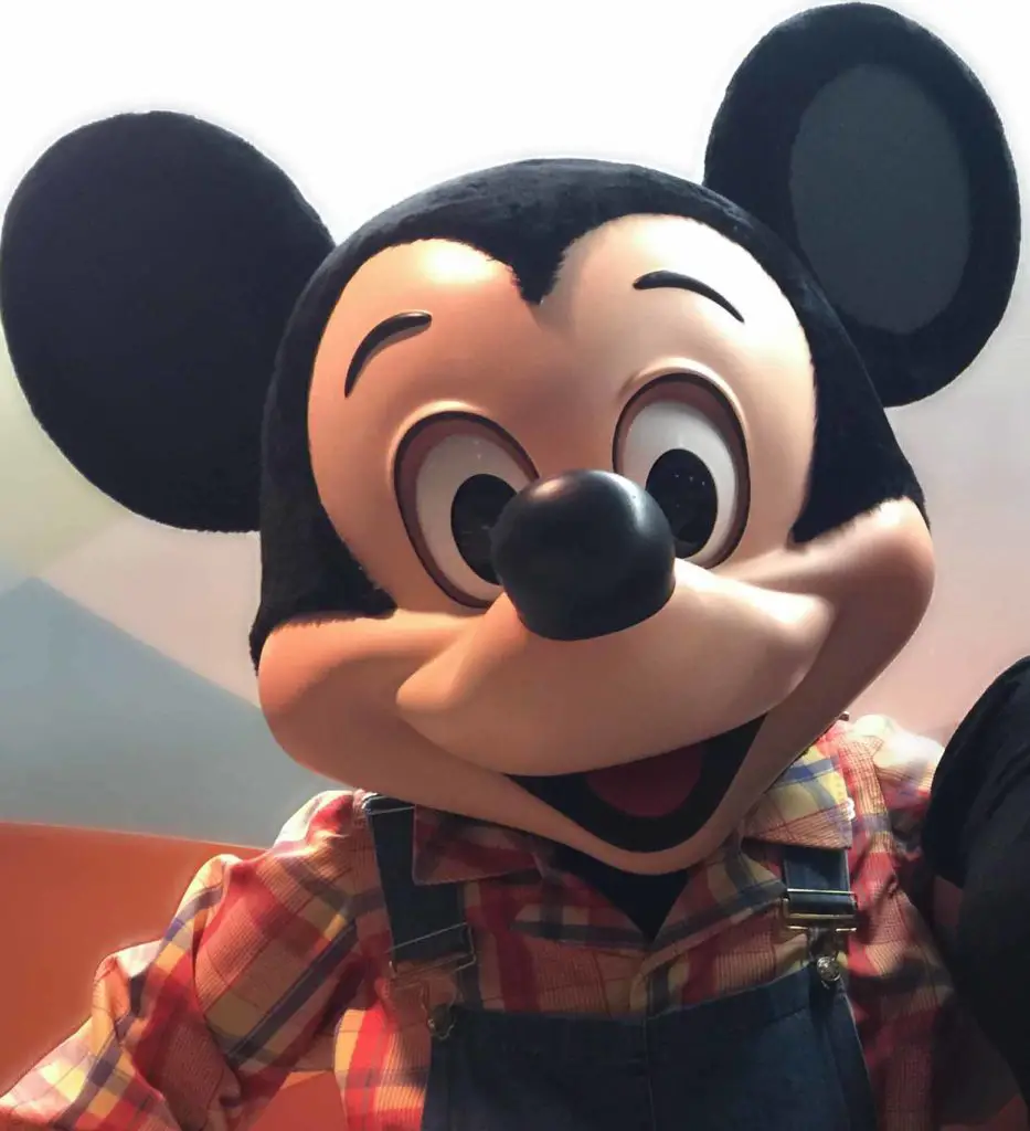 Mickey Mouse in farmer's costume at Garden Grill Restaurant
