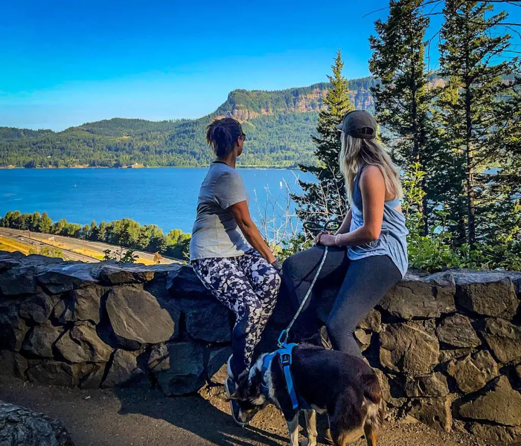 Mother daughter travel bloggers enjoy the view of the Columbia River Gorge from the Multnomah Falls Trail