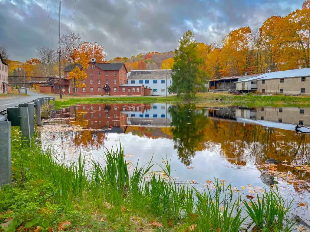 Historic drum factory surrounded by New England fall colors