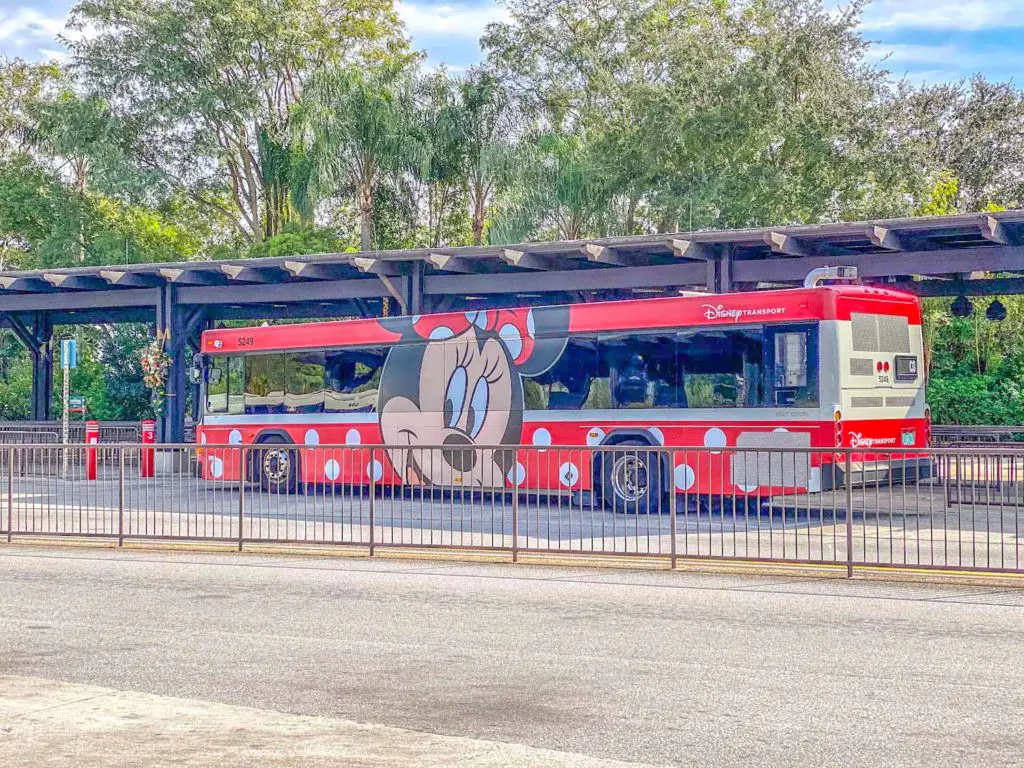 Disney World bus wrapped with MInnie Mouse character art.