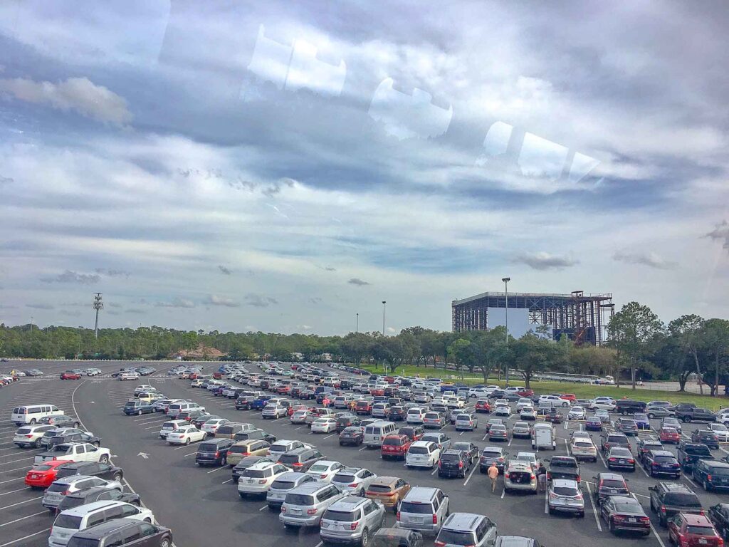 cars parked in a large parking lot at Disney World Transportation ticket center