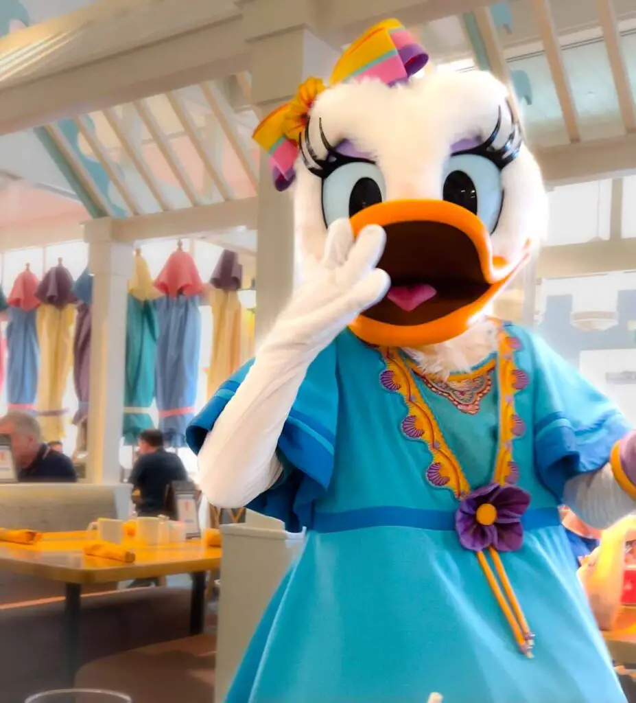 Daisy Duck blows a kiss to diners at a Walt Disney World character meal.