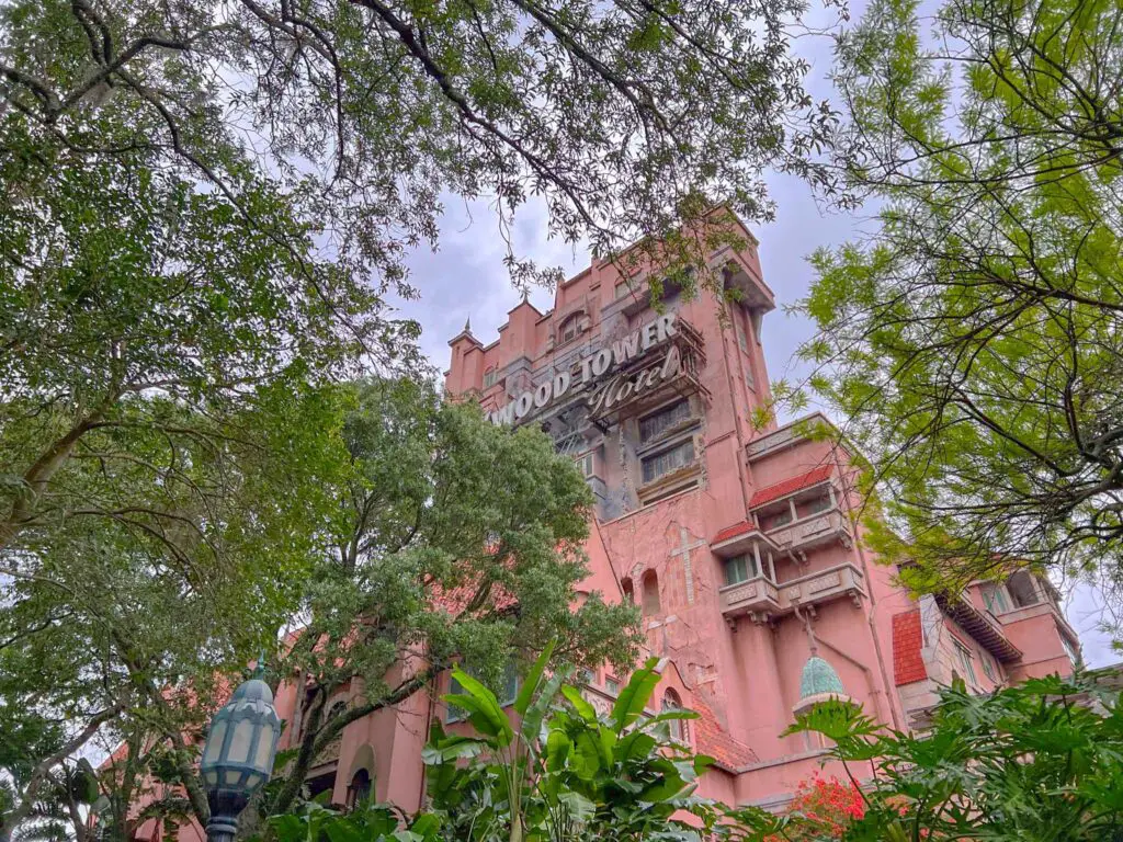 Tower of Terror through the trees, a Hollywood Studios Genie+ ride.