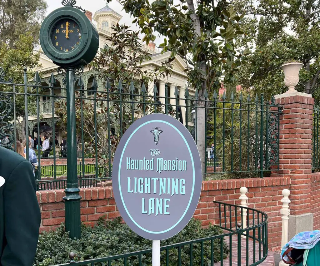 Disneyland genie+ Lightning Lane entry sign for Haunted Mansion