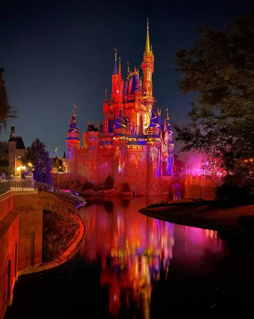 Cinderella's castle bathed in ghostly light at Walt Disney World Halloween Party