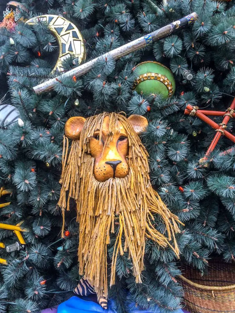 Lion shaped Christmas ornament on Christmas tree at Animal Kingdom: Holidays at Disney World
