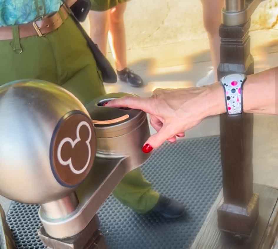 Guest scans fingerprint on a first trip to Disney World