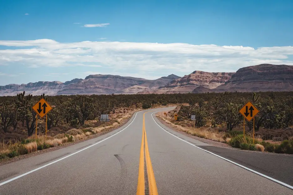 Empty road leading through the U.S. desert.