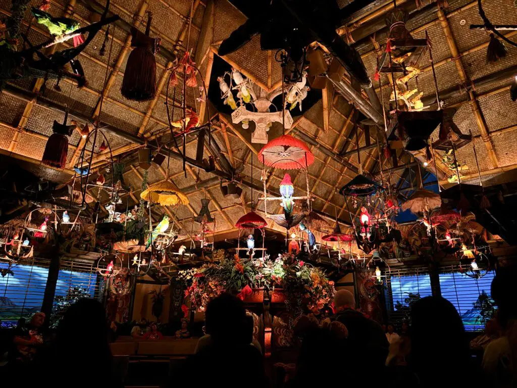 Birds emerging from the ceiling in the Enchanted Tiki Room, one of the things to skip at Disney World.