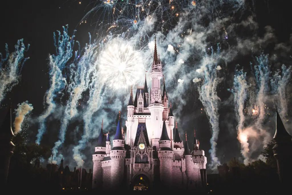 Fireworks erupt behind Cinderella's Castle on a day in Magic Kingdom