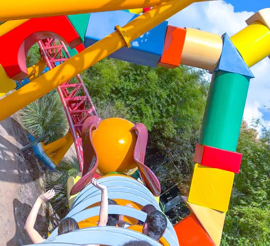 Slinky Dog Dash coaster rounds a curve in the track, demonstrating how many days to stay at Disney World