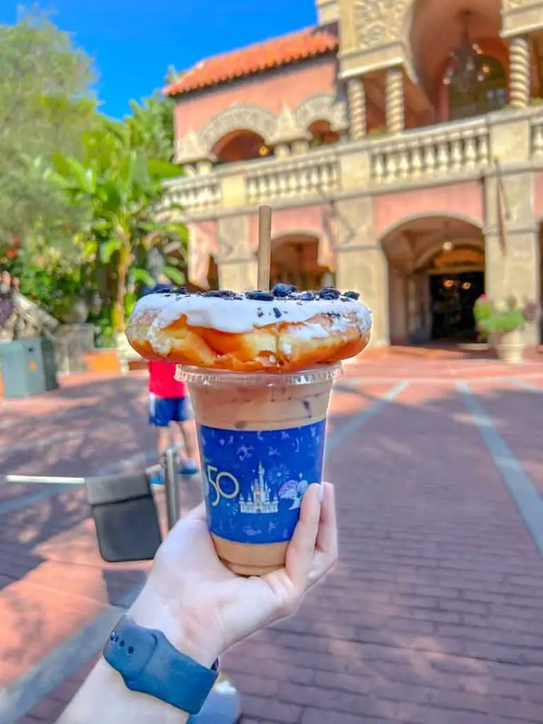 A donut balances on a Joffrey's cup of iced coffee, making the perfect Disney Hollywood Studios Breakfast