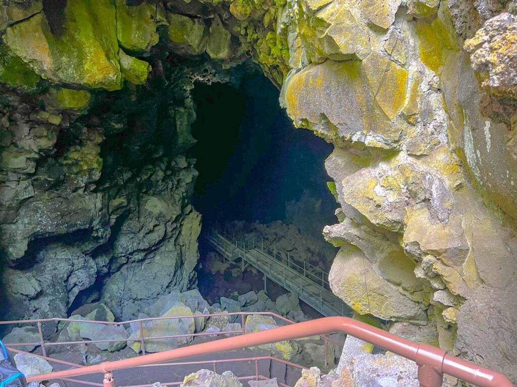 Stairs lead down into the abyss of Lava River Cave Oregon.