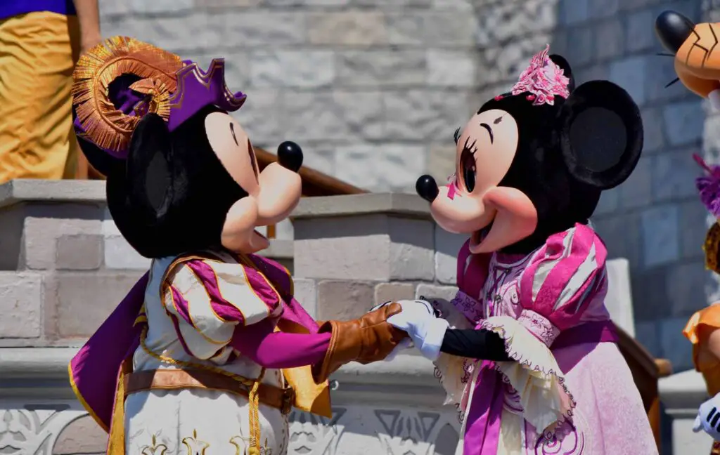 Mickey and Minnie perform in a live stage show at Magic Kingdom, an important consideration when determining how many days to spend at Disney World.