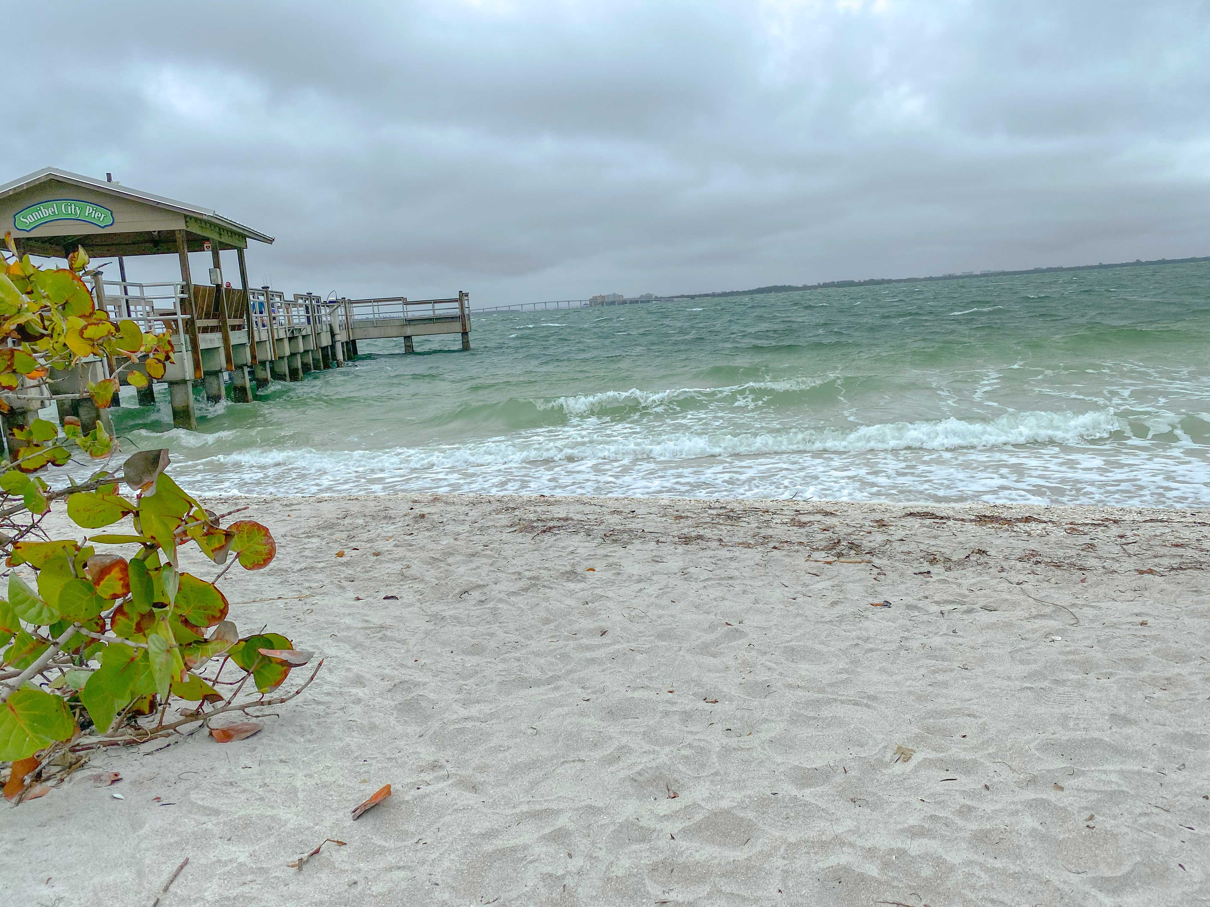 pier on Sanibel Island with a view of the crashing waves. 