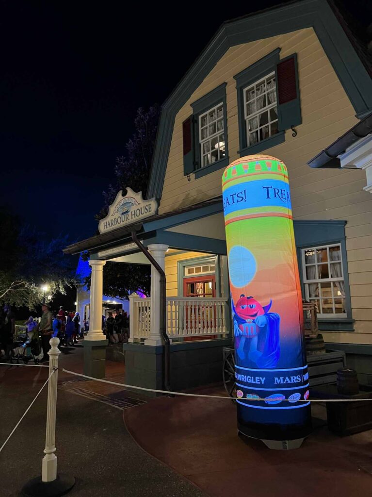 Light up post indicating trick or treat station at Mickey's Not So Scary Halloween Party.