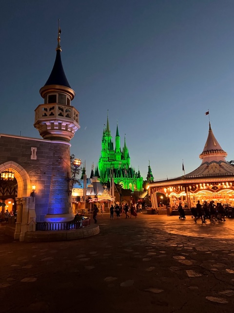 Cinderella's Castle bathed in green light for the Mickey's Not So Scary Halloween Party; Holidays at Disney World