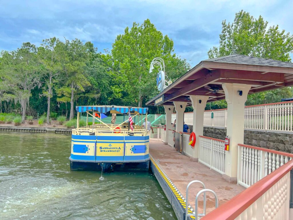 Ferry boat tied to a dock, loading passengers.