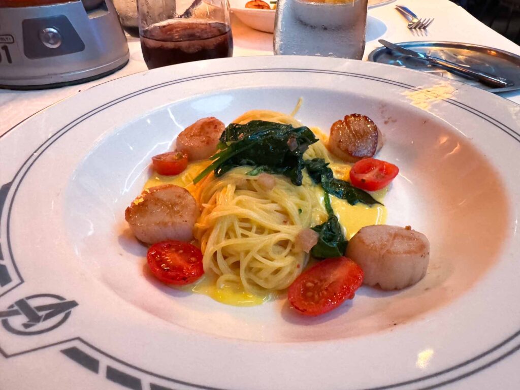 Scallops with saffron pasta, an excellent dish that makes DISNEY CRUISE LINE worth it for many passengers.