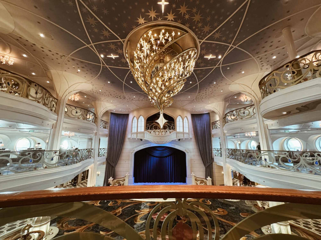 Main deck on Disney Wish, with beautiful glasswork and upscale details.