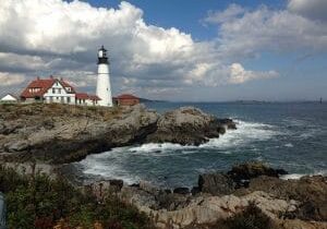 Lighthouse on rocky New England coast