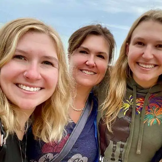 Seconds to Go mother daught travel bloggers and travel planners pose for a selfie in front of the ocean on a St. Croix island beach.