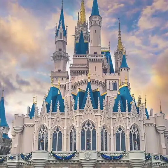 Magic Kingdom castle with colored sky.