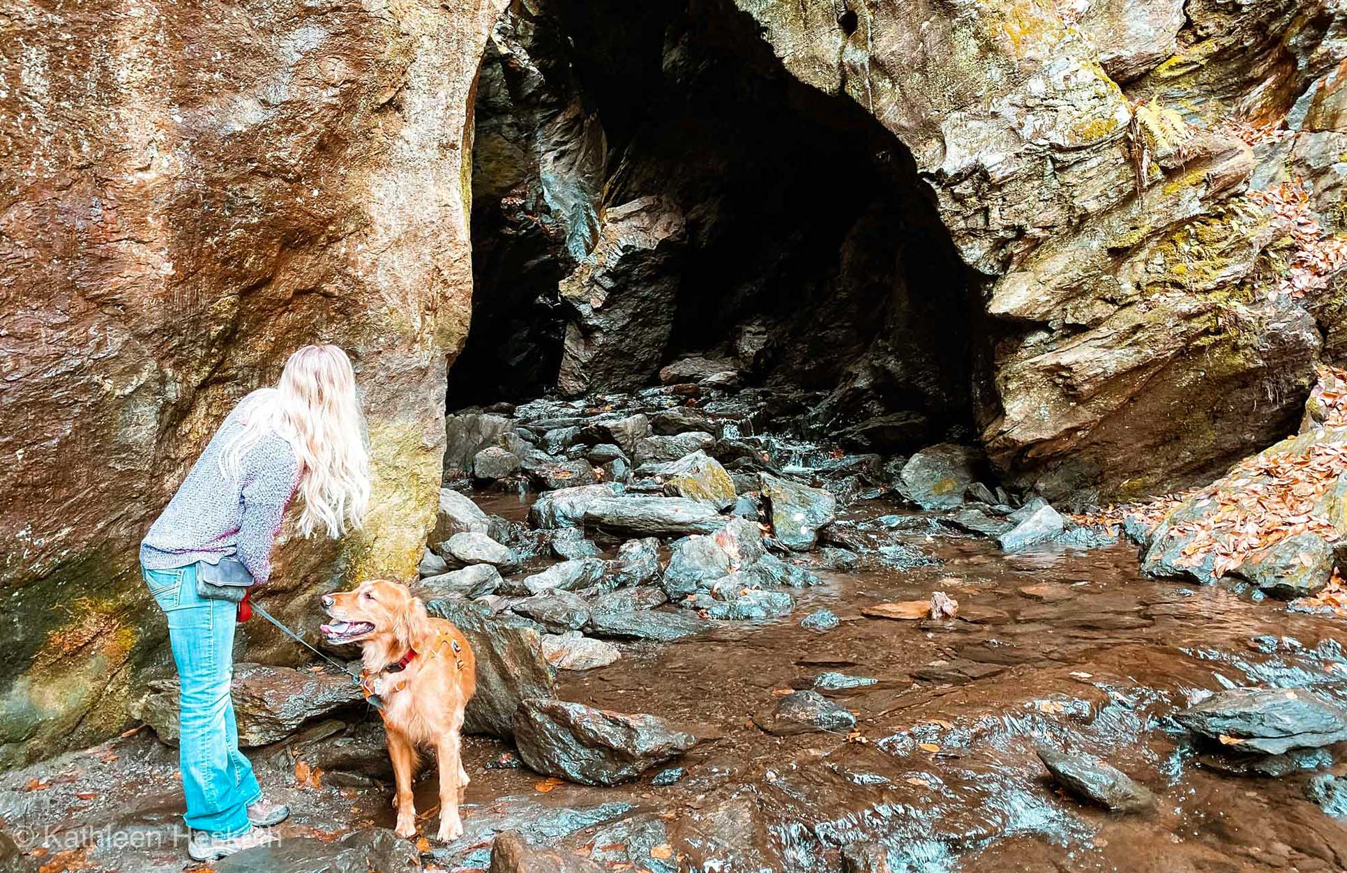 girl and golden retriever look inside Dover Stone Church