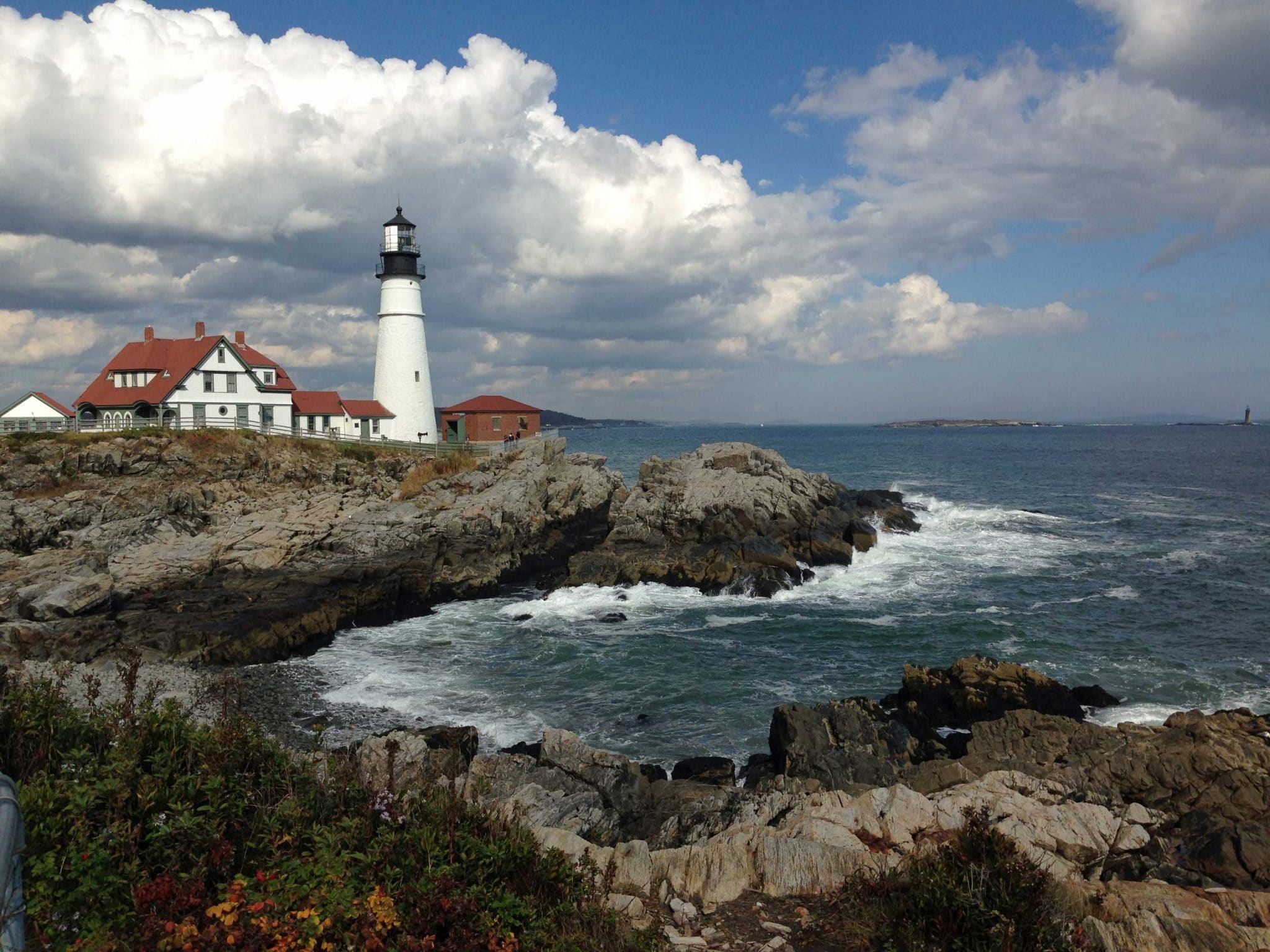 Lighthouse on rocky New England coast